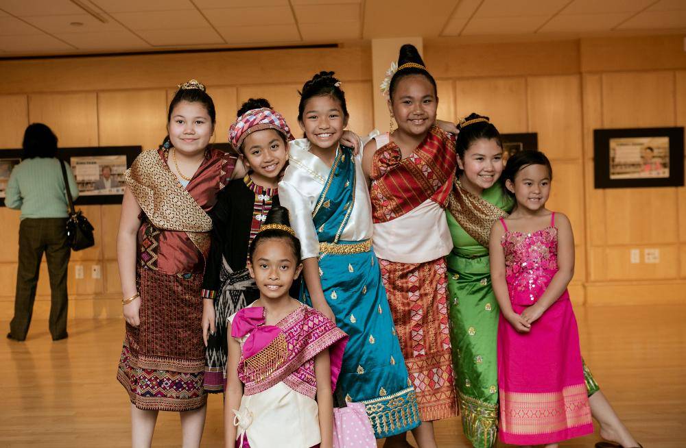 A group of girls dressed up to perform a dance